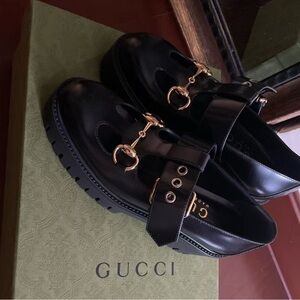 Gucci Black Loafers with Gold Accents